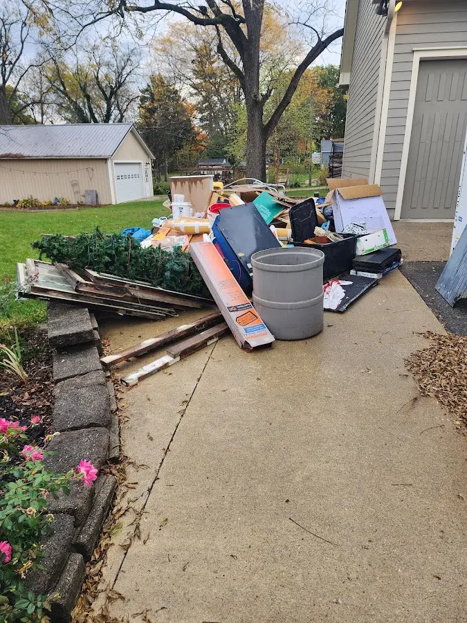 Dumpster being loaded with debris for 3 Yard Dumpster Rental in Ocean Pointe